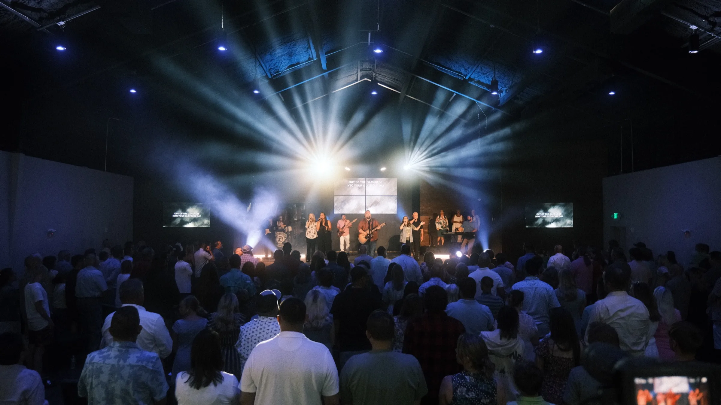 Discovery Church gathered for worship, the band leading a packed room under stage lights.