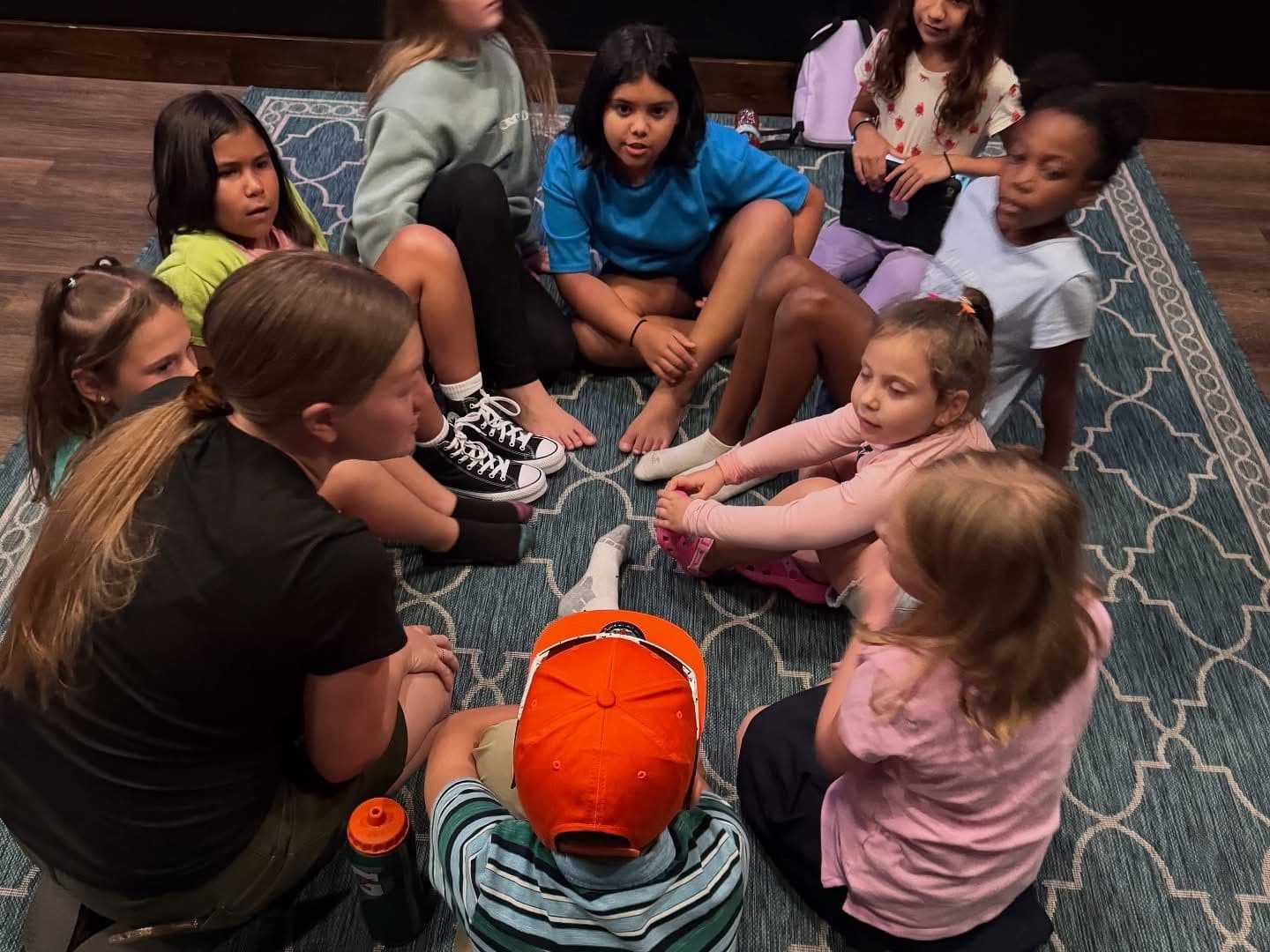 Kids and a leader mid-activity in a Discovery Kids classroom on a Sunday morning.