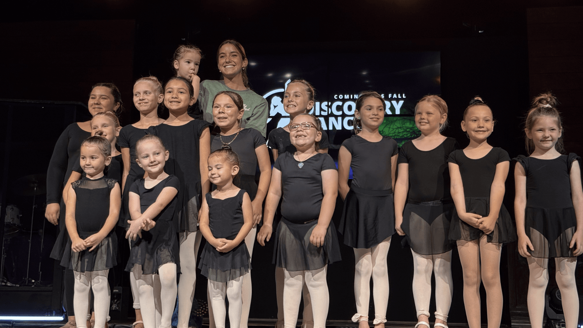 Young dancers mid-movement in a Discovery Dance class at the Fort Pierce campus.
